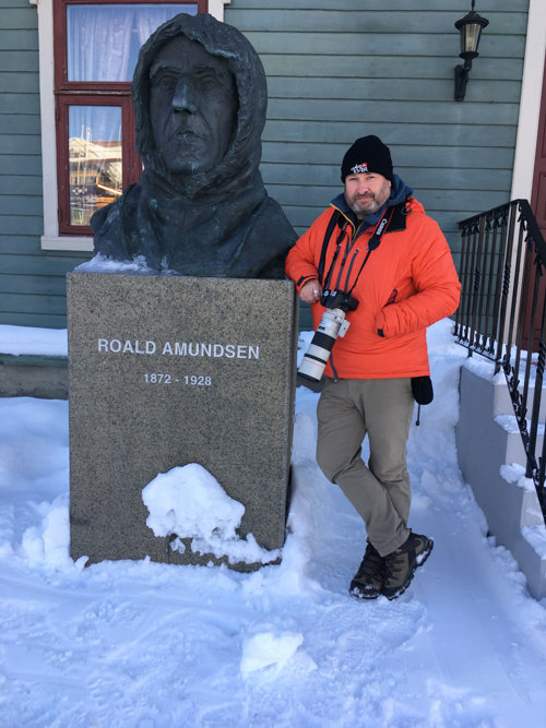 Andy Gilbert beside Roald Amundsen bust outside the Polar Museum in Tromso, Norway