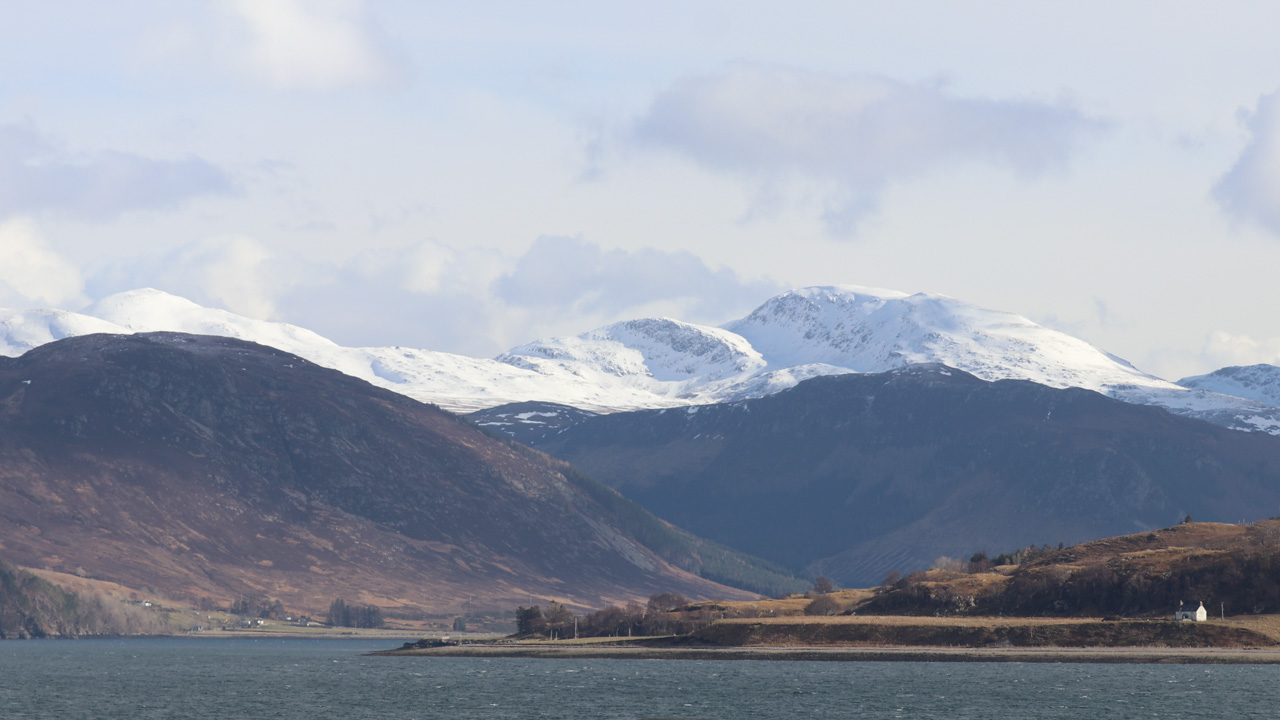 Snow covered peaks at the end of Loch Broom, Wester Ross, Scotland